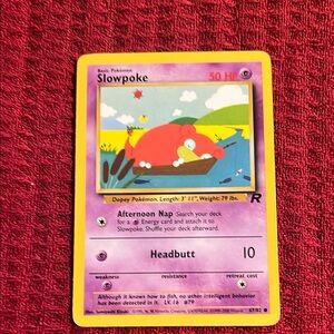 SLOWPOKE. Pokemon Trading Card with Purple and Yellow